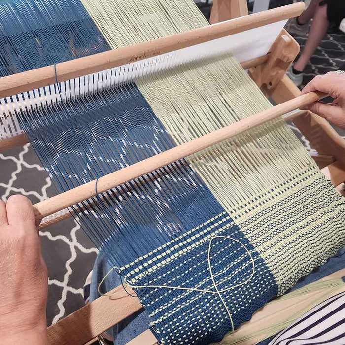 Weaving loom and essential tools for beginning to weave