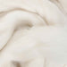Close-up Natural white baby alpaca combed top by Ashford for spinning, felting, dyeing and fiber blending