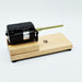Leclerc electric bobbin winder (1-end model) mounted on wooden base — side view.