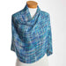 Handwoven shawl in cool blue and turquoise tones made with Ashford Caterpillar Yarn.