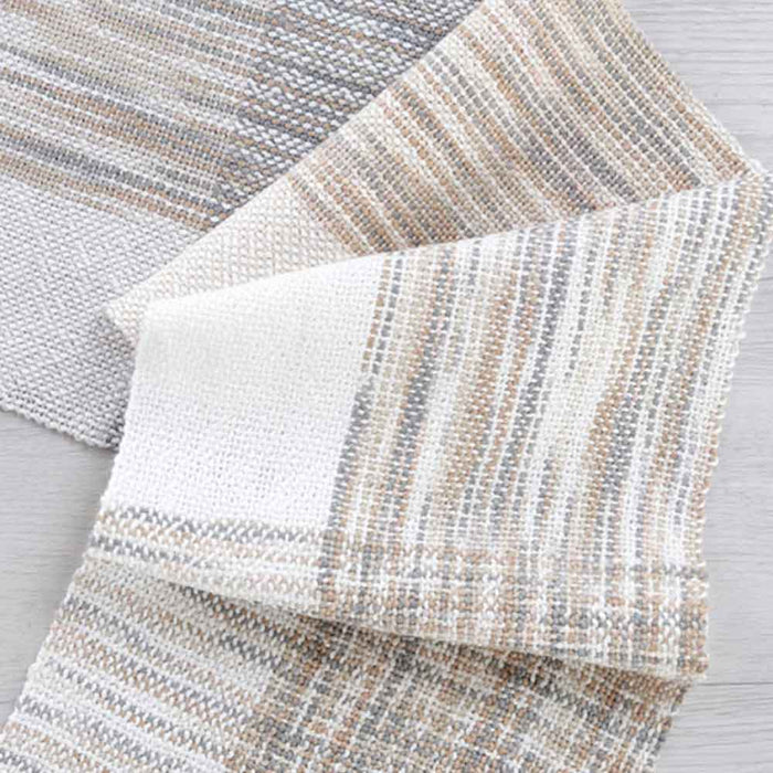 Handwoven neutral fabric showing texture and color variation of Ashford Caterpillar Yarn.