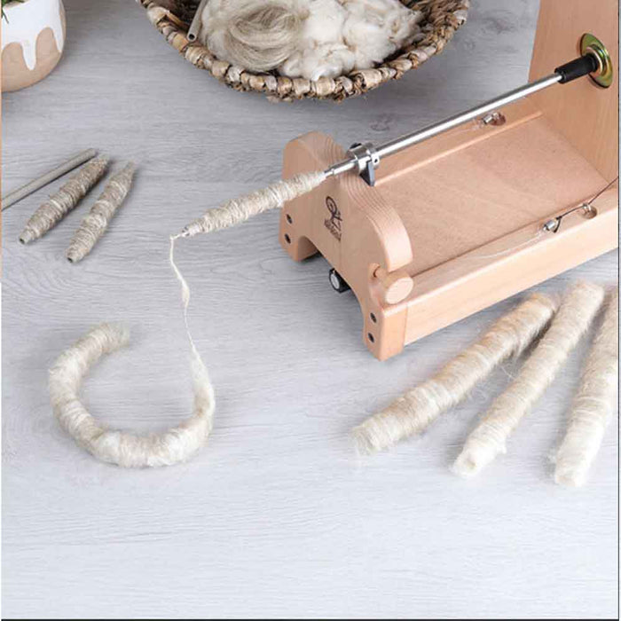 Ashford e-Spinner 3 with Quill Spindle attachment in use – spinning fiber directly from the quill to create textured yarn.