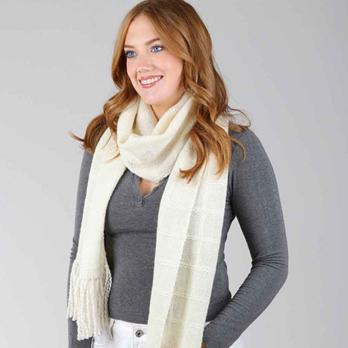 Ashford Weaving Kit 1 – model wearing the handwoven Lattice Scarf made with Merino/Viscose/Linen and New Zealand wool yarns.