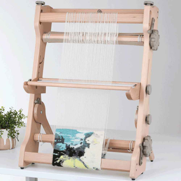 Reed positioned low on Ashford table tapestry loom showing adjustable height
