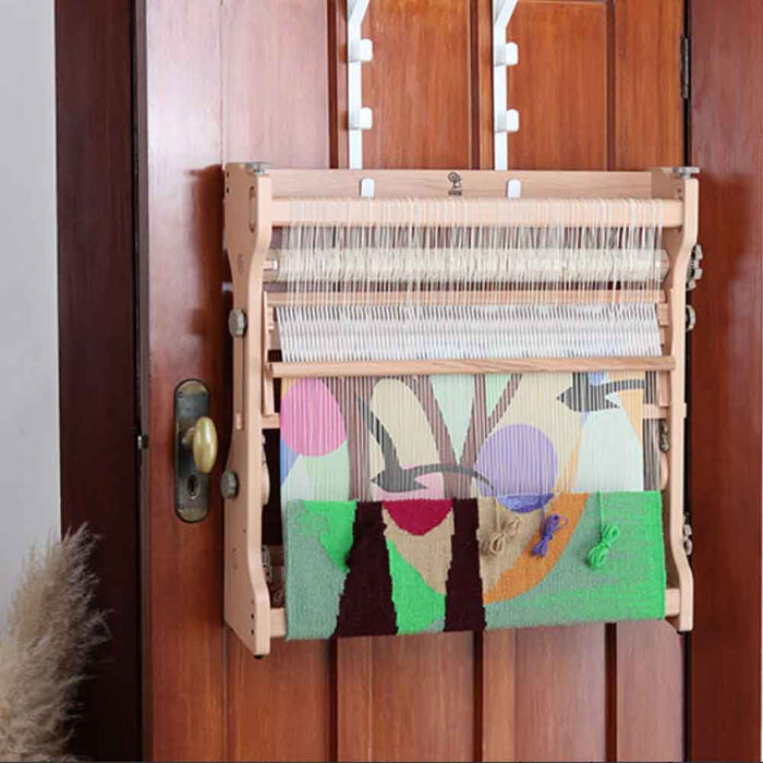 Ashford table tapestry loom displayed with wall tapestry hanging