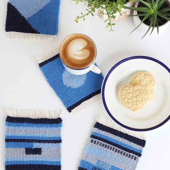 Handwoven tapestry coasters made on a table tapestry loom