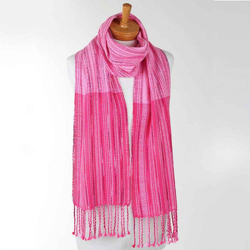 Bright pink handwoven cotton scarf made with the Ashford Weaving Kit 2 – Spring colorway, woven on an Ashford rigid heddle loom using unmercerised cotton and Caterpillar Cotton yarns.