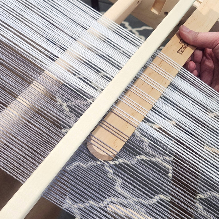 Using a pickup stick on a rigid heddle loom to create additional weave structures
