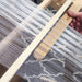 Using a pickup stick on a rigid heddle loom to create additional weave structures
