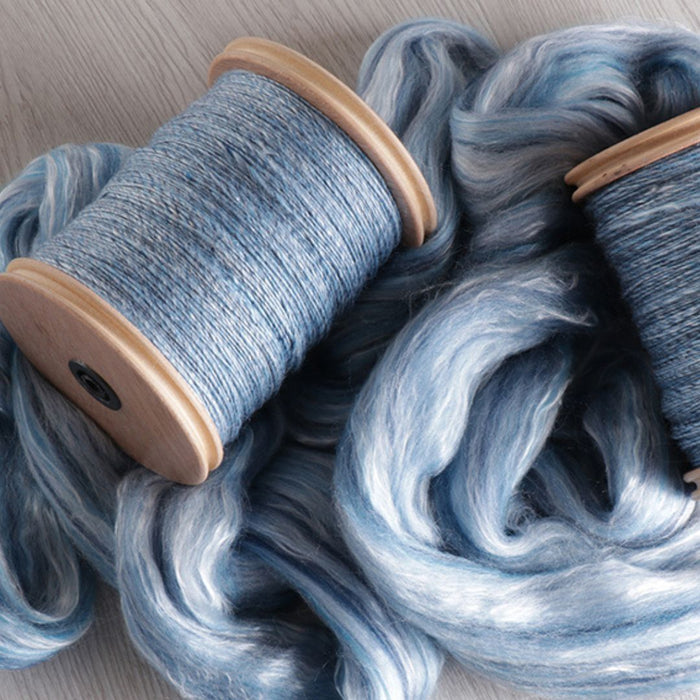 Handspun two-ply yarn and prepared fibre used during a spinning workshop
