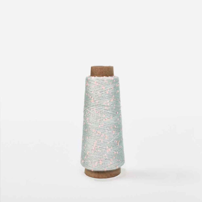 Light blue spool of Creative Make It Blümchen paper yarn by Rico Yarns – textured and lightweight for decorative textile projects