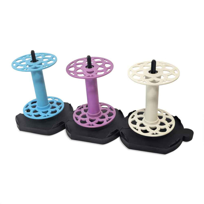 EEW Lazy Kate with three colorful EEW 6.1 bobbins mounted for plying on Dreaming Robots electric spinning wheel.