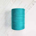 Cone of aquamarine cotolin weaving yarn by Brassard