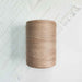 Cone of beige cotolin weaving yarn by Brassard