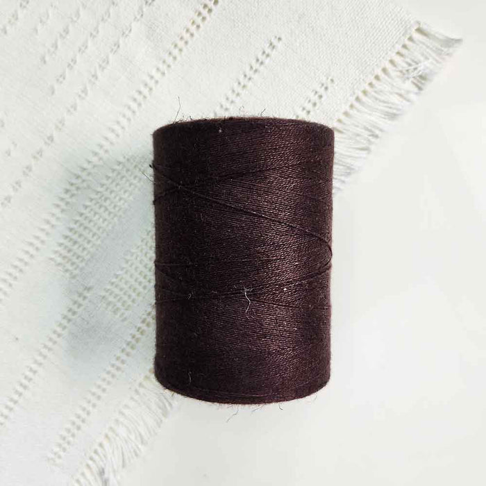 Cone of brun chocolat cotolin weaving yarn by Brassard