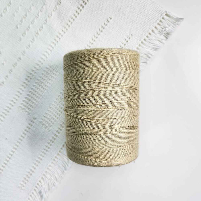 Cone of ivoire cotolin weaving yarn by Brassard