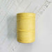 Cone of jaune fonce cotolin weaving yarn by Brassard