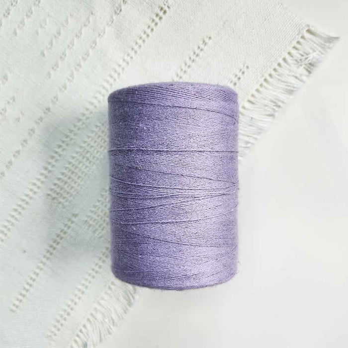 Cone of lavande cotolin weaving yarn by Brassard