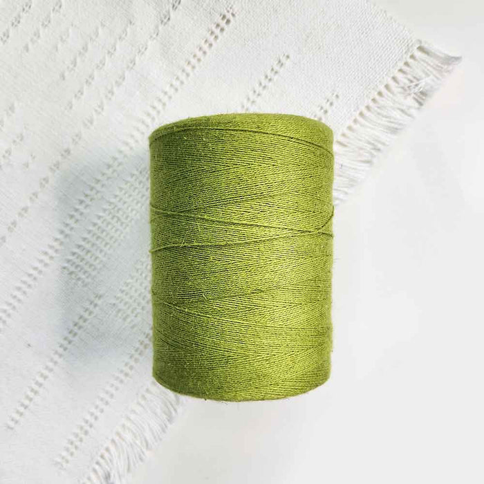 Cone of llmette cotolin weaving yarn by Brassard