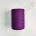 Cone of mauve cotolin weaving yarn by Brassard