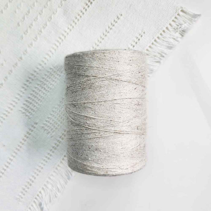 Cone of naturel cotolin weaving yarn by Brassard