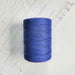 Cone of periwinkle cotolin weaving yarn by Brassard