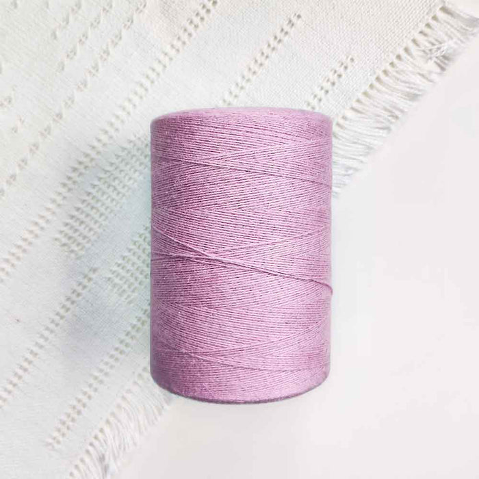 Cone of rose pale cotolin weaving yarn by Brassard
