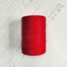 Cone of rouge cotolin weaving yarn by Brassard