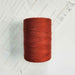 Cone of rouille cotolin weaving yarn by Brassard