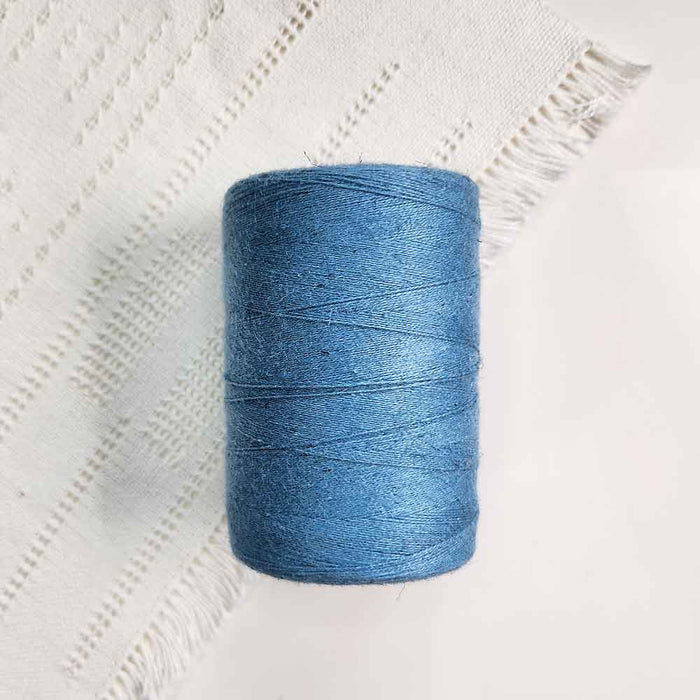 Cone of slate cotolin weaving yarn by Brassard