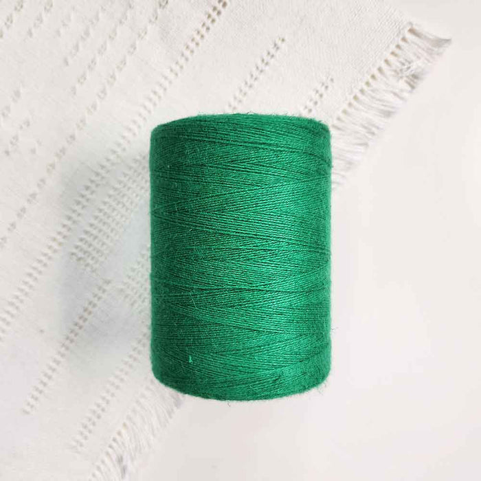 Cone of vert emeraude cotolin weaving yarn by Brassard