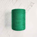 Cone of vert emeraude cotolin weaving yarn by Brassard