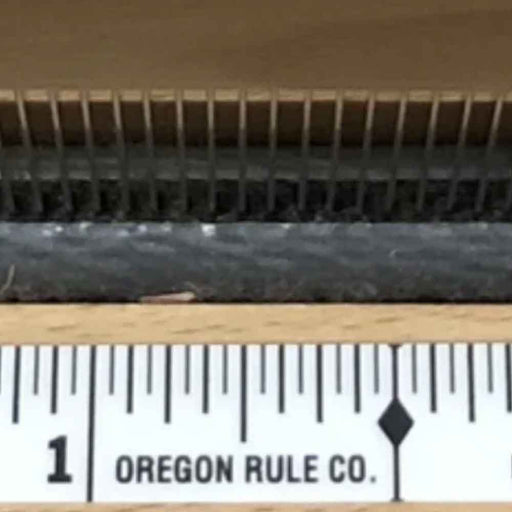 Close-up of the centering tape graduations used to measure from the center of the loom.