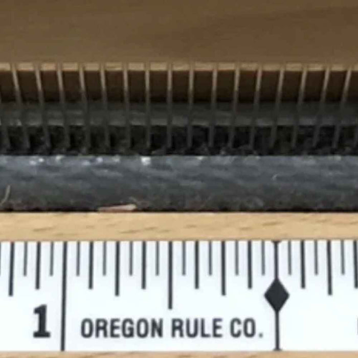 Close-up of the centering tape graduations used to measure from the center of the loom.