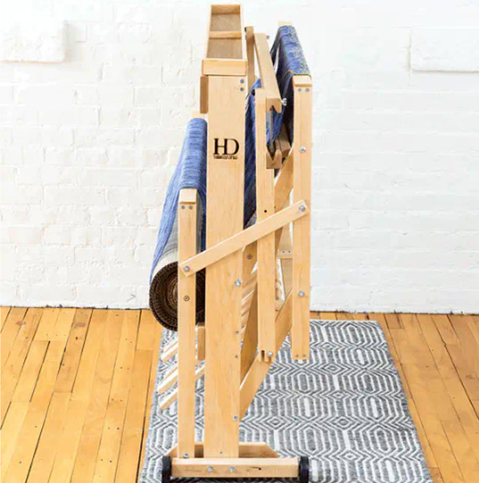 Side angle of Harrisville Designs 4-shaft floor loom showing loom folded