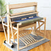 Harrisville Designs 4-shaft floor loom front view with blue fabric on the warp