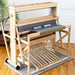 Harrisville Designs 8-shaft floor loom with blue fabric on the warp
