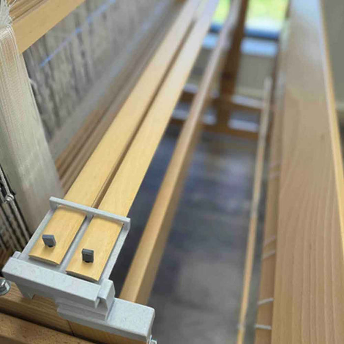 Helping Hands holding lease sticks on a Louet Octado loom