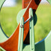 Close up of Kromski Fantasia Meadow Green spinning wheel treadle mechanism and curved frame detail