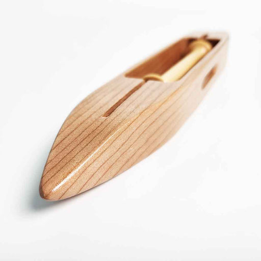 Angled view of Leclerc 6122-0000 small wooden weaving shuttle