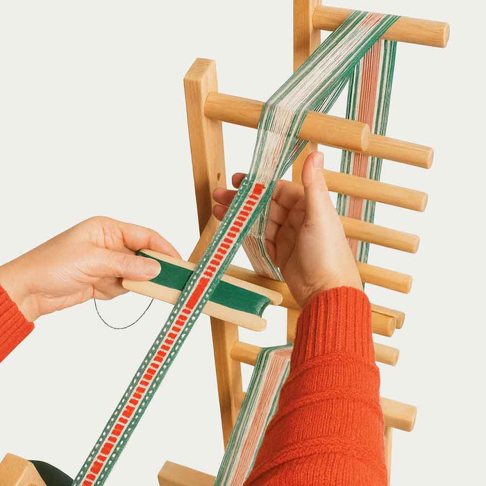 Warping yarn on the Leclerc Cendrel inkle loom used as a warping frame