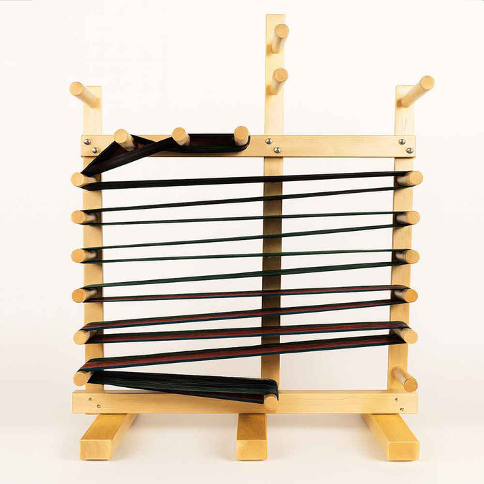 Leclerc Cendrel inkle loom with warp installed, showing adjustable pegs and wooden frame