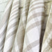 Close-up of handwoven linen dish towel with striped pattern