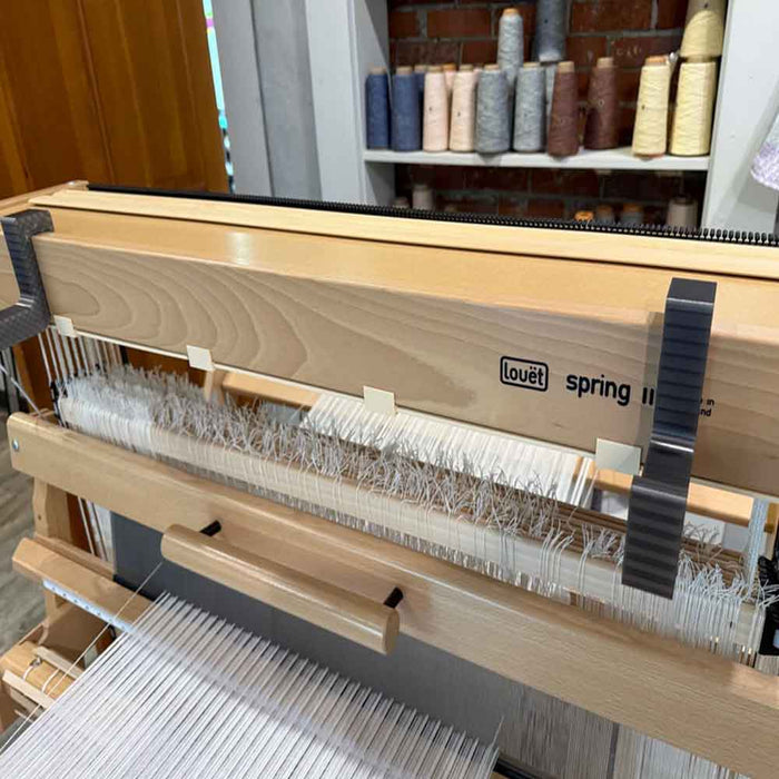 Lofty Fiber beater holder supporting loom beater during reed sleying