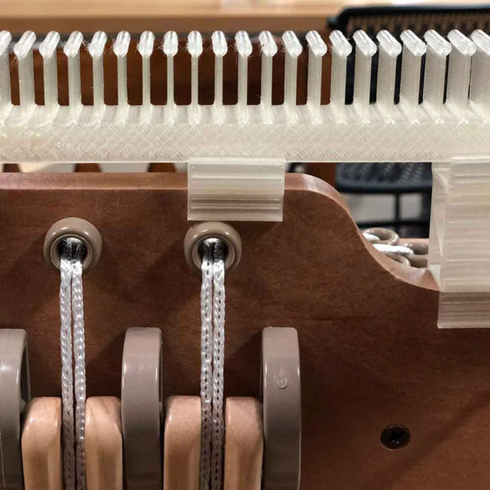 Close-up of Lofty Fiber raddle clips on an Ashford loom