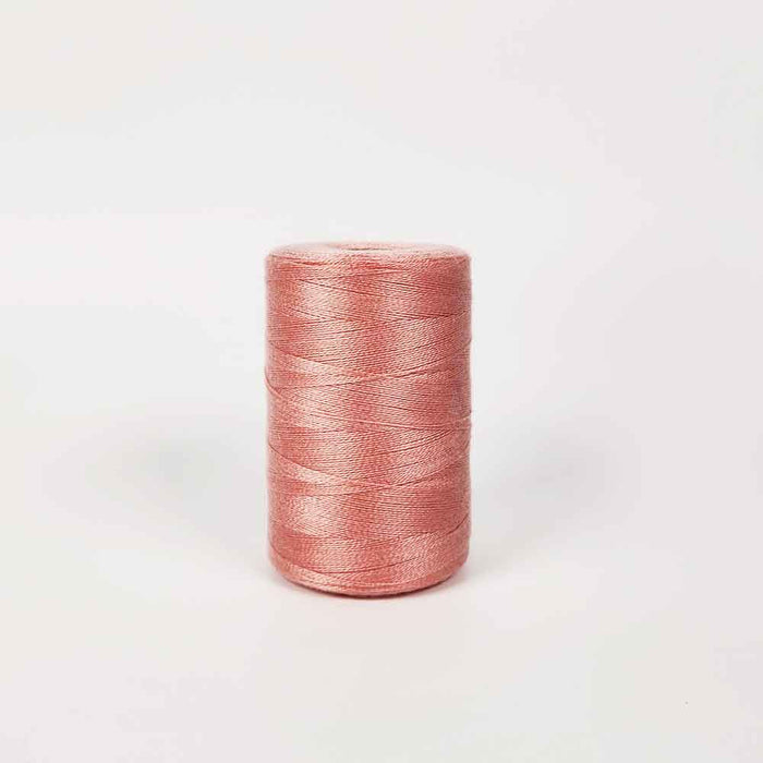 Saumon Tencel yarn spool by Maurice Brassard for weaving projects