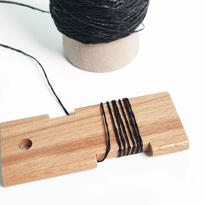 Mondofil Gommina coated yarn used in weaving on wooden support showing structured effect