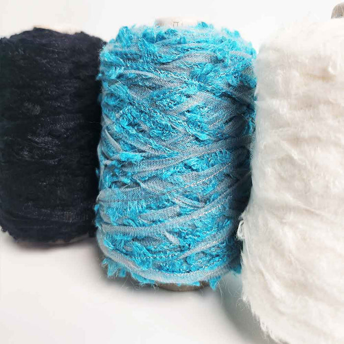 Selection of Mondofil Ischia mohair yarn cones in multiple colors
