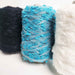 Selection of Mondofil Ischia mohair yarn cones in multiple colors