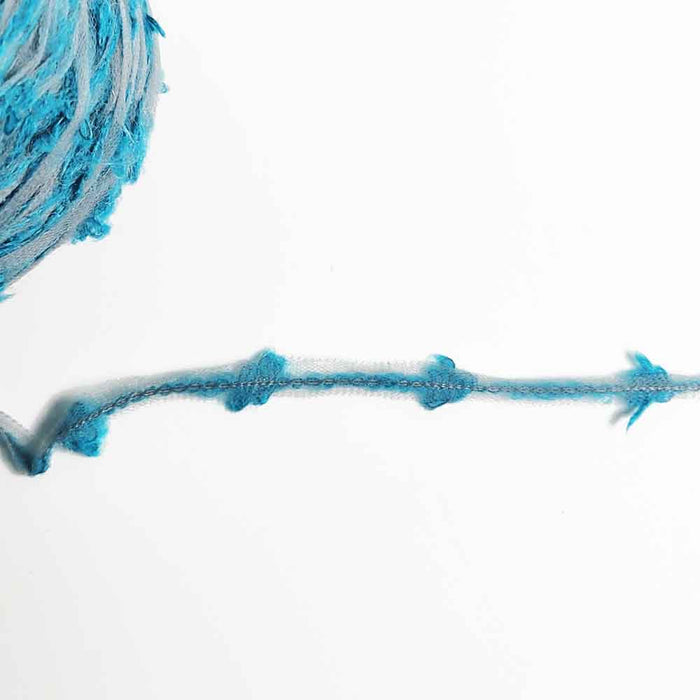 Close-up of Mondofil Ischia mohair yarn strand showing texture